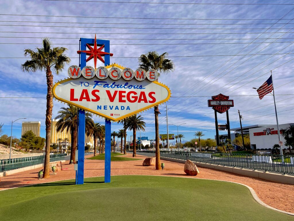 Las Vegas sign with palm trees in the background